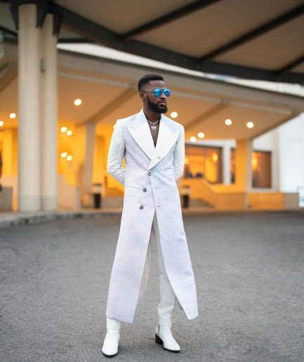 A monochrome, peak lapel, light multi-color dyed trench double breasted jacquard with bunny button details suit