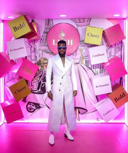 A monochrome, peak lapel, light multi-color dyed trench double breasted jacquard with bunny button details suit