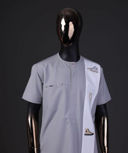 A pewter grey front flap with gold Swarovski button detailing and side all-stars embroidery detailing on white kaftan and Sokoto