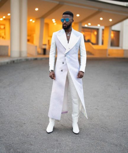 A monochrome, peak lapel, light multi-color dyed trench double breasted jacquard with bunny button details suit
