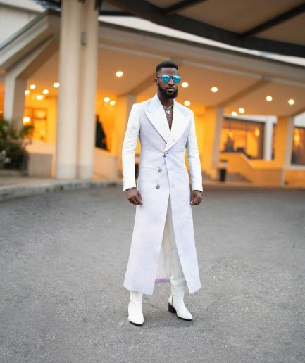 A monochrome, peak lapel, light multi-color dyed trench double breasted jacquard with bunny button details suit