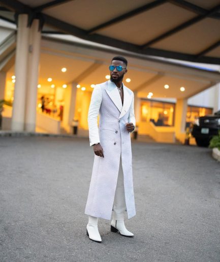 A monochrome, peak lapel, light multi-color dyed trench double breasted jacquard with bunny button details suit