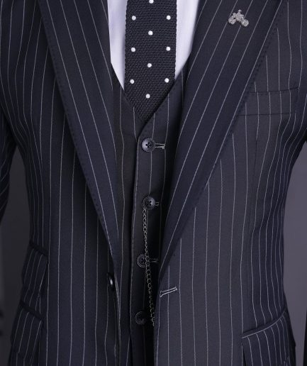 A charcoal black and ivory pencil stripe, notch lapel, knitted one button suit