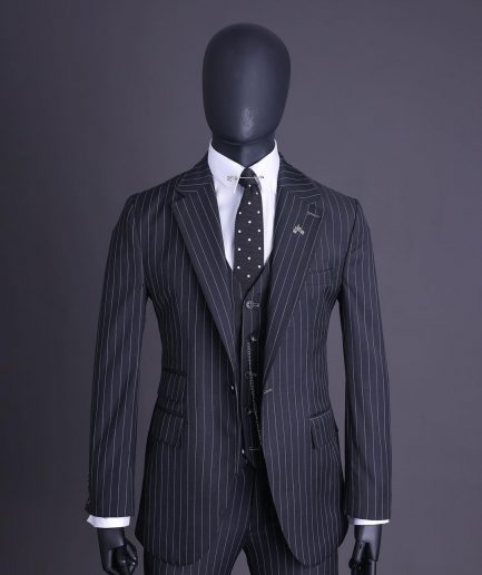 A charcoal black and ivory pencil stripe, notch lapel, knitted one button suit