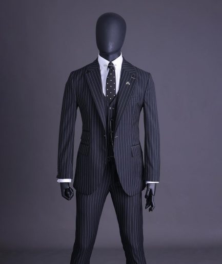 A charcoal black and ivory pencil stripe, notch lapel, knitted one button suit