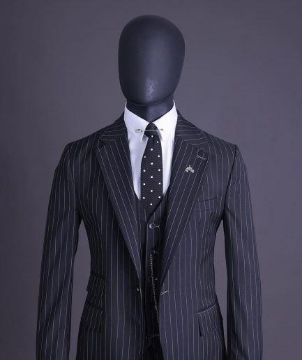 A charcoal black and ivory pencil stripe, notch lapel, knitted one button suit