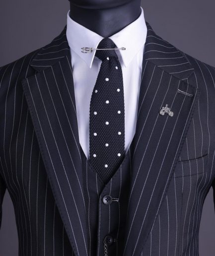 A charcoal black and ivory pencil stripe, notch lapel, knitted one button suit
