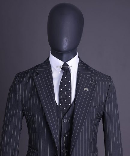 A charcoal black and ivory pencil stripe, notch lapel, knitted one button suit