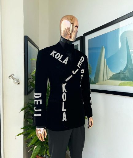 An “inscribe” your name charcoal black soaked velvet peak lapel wrap tuxedo suit