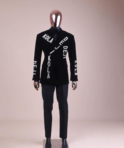 An “inscribe” your name charcoal black soaked velvet peak lapel wrap tuxedo suit