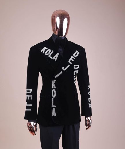 An “inscribe” your name charcoal black soaked velvet peak lapel wrap tuxedo suit