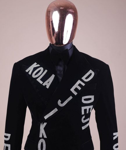 An “inscribe” your name charcoal black soaked velvet peak lapel wrap tuxedo suit