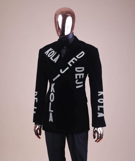 An “inscribe” your name charcoal black soaked velvet peak lapel wrap tuxedo suit