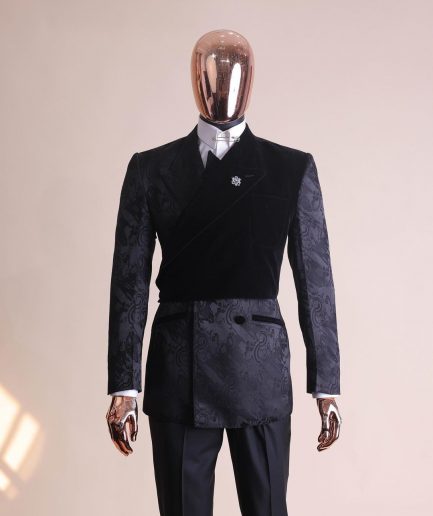A charcoal black “equalizer” quadruple breasted, knitted, layered peak lapel with velvet overlay-ed tuxedo jacquard suit