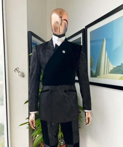 A charcoal black “equalizer” quadruple breasted, knitted, peak lapel with velvet tuxedo jacquard suit