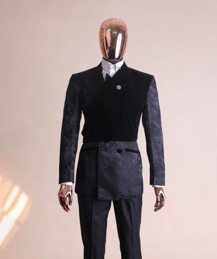 A charcoal black “equalizer” quadruple breasted, knitted, layered peak lapel with velvet overlay-ed tuxedo jacquard suit