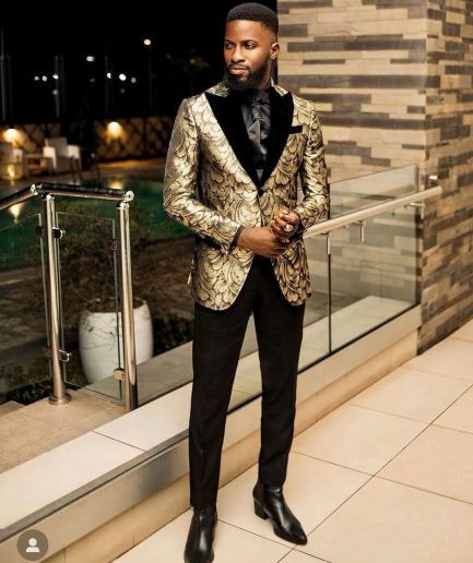 A Charcoal Black And Gold Splash, Peak Lapel Tuxedo Suit.