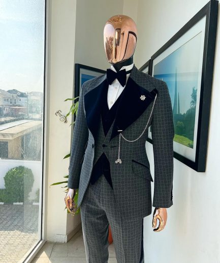 A grey octagonal patterned, navy blue mix, wide notch lapel, single button suit