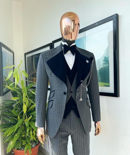 A grey octagonal patterned, navy blue mix, wide notch lapel, single button suit