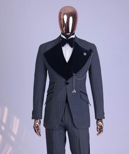 A grey octagonal patterned, navy blue mix, wide notch lapel, single button suit