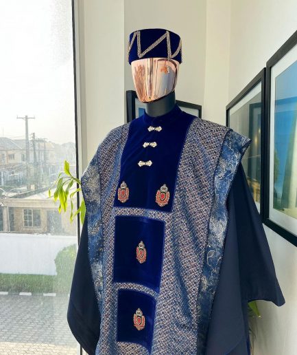 A “krosscut” layered, minted Gold, Skye, navy and admiral blue mix metallic jacquard front cut agbada.