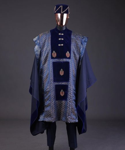 A “krosscut” layered, minted Gold, Skye, navy and admiral blue mix metallic jacquard front cut agbada.