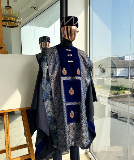 A “krosscut” layered, minted Gold, Skye, navy and admiral blue mix metallic jacquard front cut agbada.