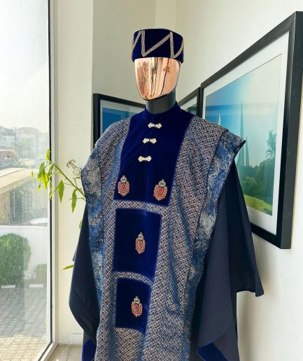 A “krosscut” layered, minted Gold, Skye, navy and admiral blue mix metallic jacquard front cut agbada.