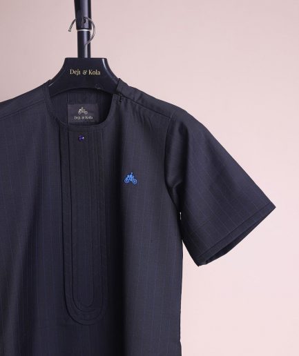 A charcoal black and admiral blue pencil stripe, invisible neckline zip line with layered front flap details, short sleeve African senator kaftan native.