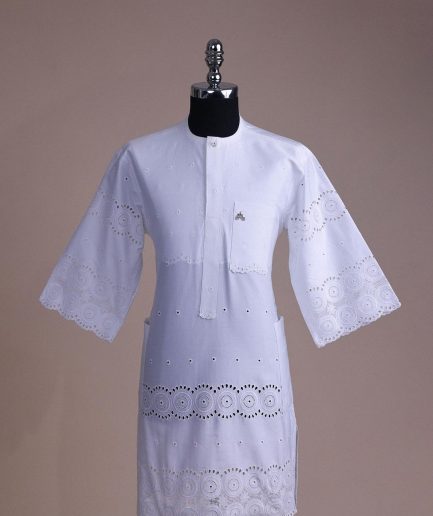 A bright white, Swiss patterned lace, front flap with Swarovski button, 3/4 sleeve African kaftan.