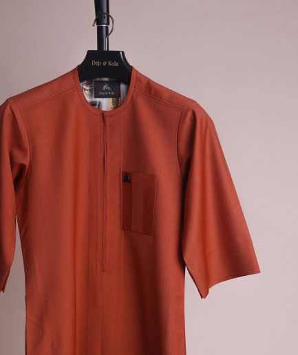 A fire orange and black pencil stripe, zipline, 3/4 sleeve African senator kaftan native.