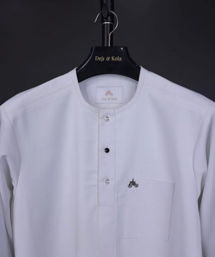 A white, front flap with mixed Swarovski button,3/4 sleeve with velvet cuff details African senator kaftan Native.
