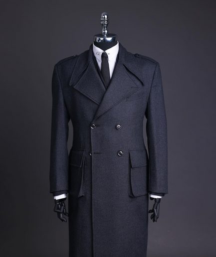 A Lead grey, double breasted, notch lapel trench coat with combat pocket.