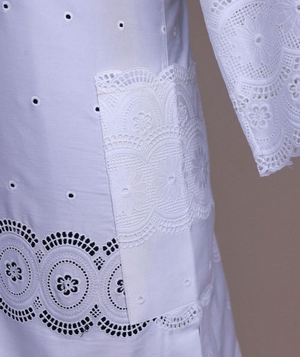 A bright white, Swiss patterned lace, front flap, 3/4 sleeve African kaftan native.