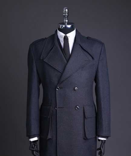A Lead grey, double breasted, notch lapel trench coat with combat pocket.