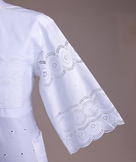 A bright white, Swiss patterned lace, front flap, 3/4 sleeve African kaftan native.