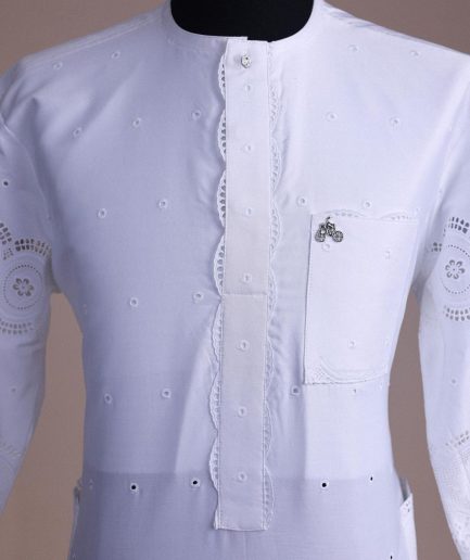 A bright white, Swiss patterned lace, front flap with side pattern, Swarovski button, 3/4 sleeve African kaftan native.