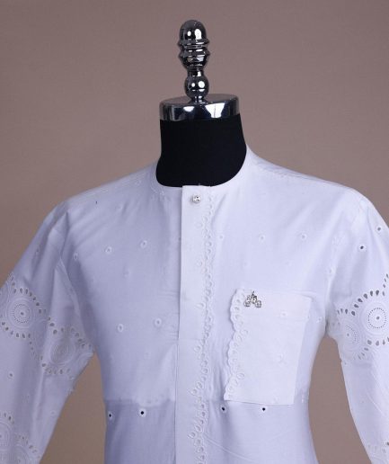 A bright white, Swiss patterned lace, front flap with left side pattern, Swarovski button, 3/4 sleeve African kaftan.