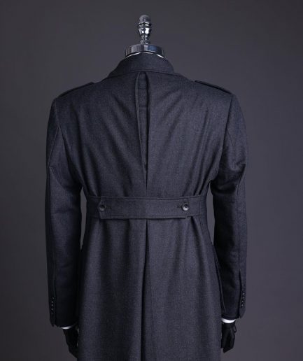 A Lead grey, double breasted, notch lapel trench coat with combat pocket.