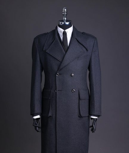 A Lead grey, double breasted, notch lapel trench coat with combat pocket.