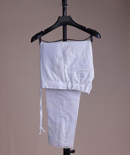 A bright white, Swiss patterned lace, front flap with left side pattern, Swarovski button, 3/4 sleeve African kaftan.