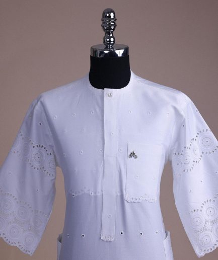 A bright white, Swiss patterned lace, front flap with Swarovski button, 3/4 sleeve African kaftan.