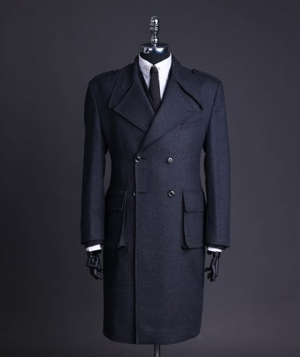 A Lead grey, double breasted, notch lapel trench coat with combat pocket.