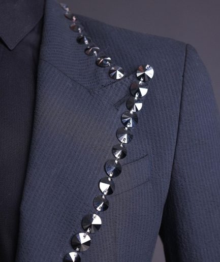 A steel black, seer sucker fabric, knitted, peak lapel suit