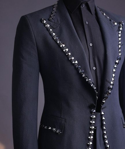 A steel black, seer sucker fabric, knitted, peak lapel suit