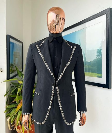 A steel black, seer sucker fabric, knitted, peak lapel suit
