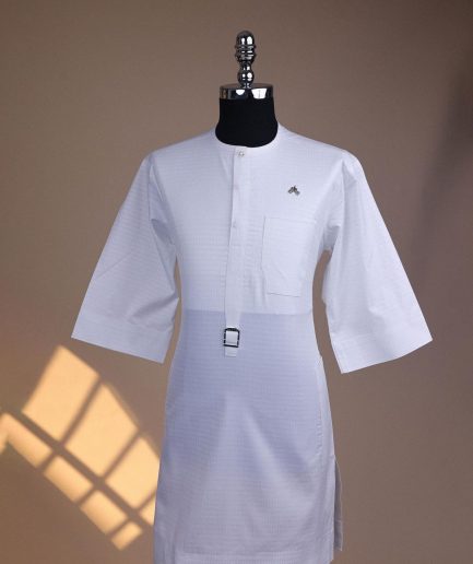 A Bright white, front flap with Swarovski button & metal tag details, 3/4 sleeve African kaftan.