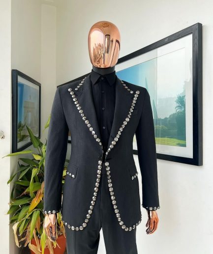 A steel black, seer sucker fabric, knitted, peak lapel suit
