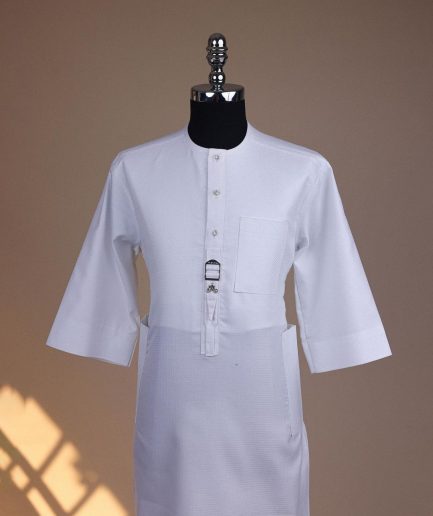 A Bright white, front flap with Swarovski button & metal tag details, 3/4 sleeve African kaftan