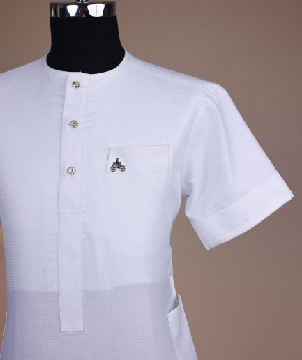 A bright white, tiny square pattern, front flap with gold Swarovski button, 3/4 sleeve African kaftan.